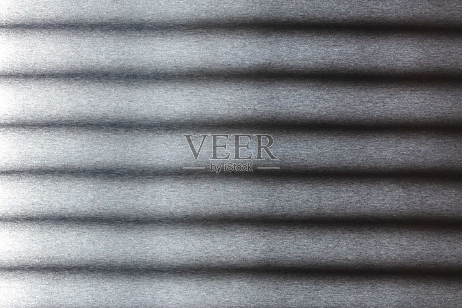 不锈钢材质。灰色金属条纹背景。宏观视图照片摄影图片