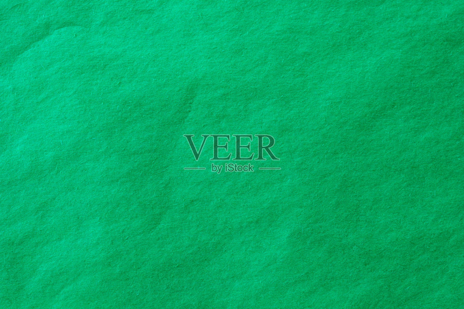 绿色皱纸纹理背景。照片摄影图片