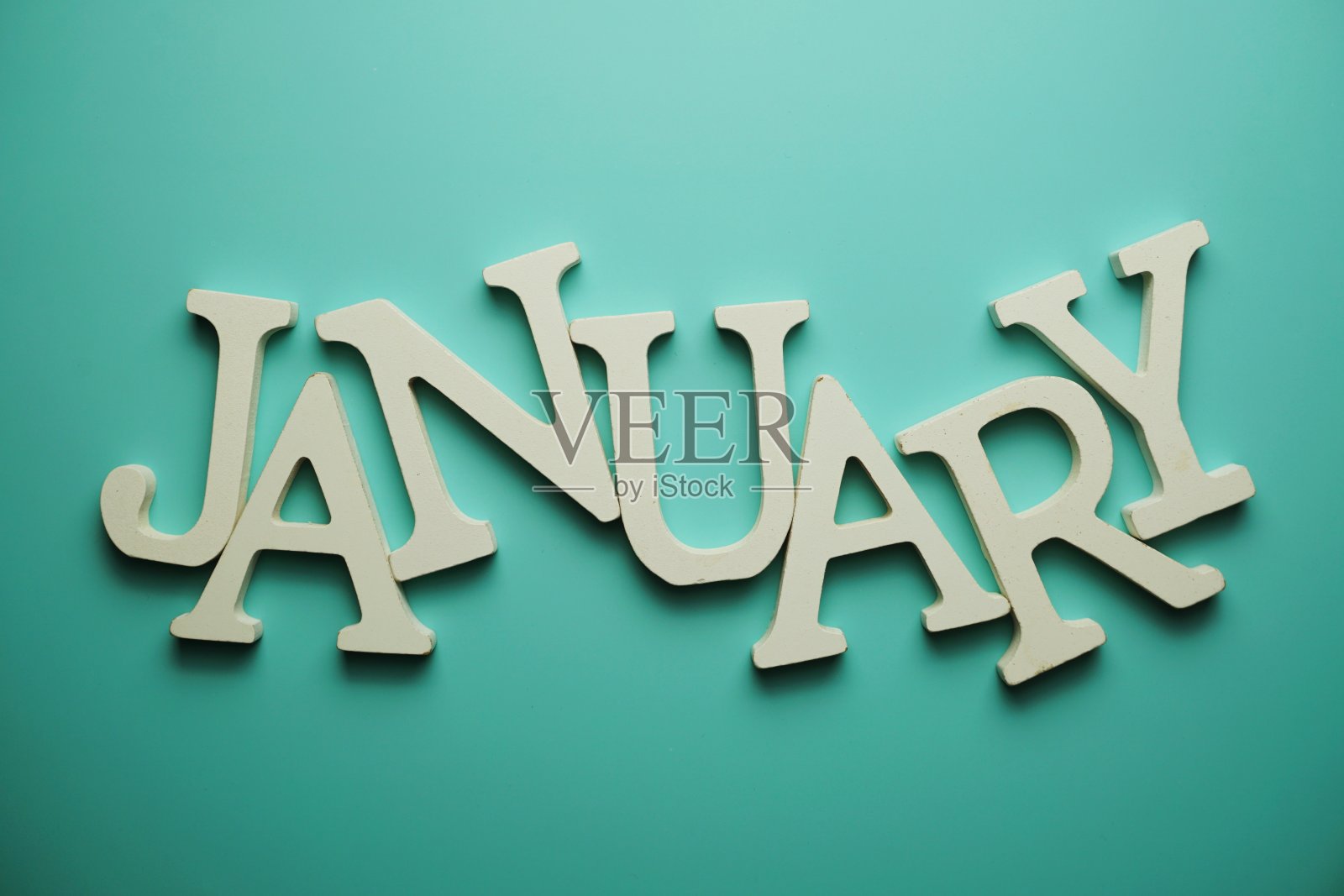 一月字母表字母在蓝色的背景照片摄影图片