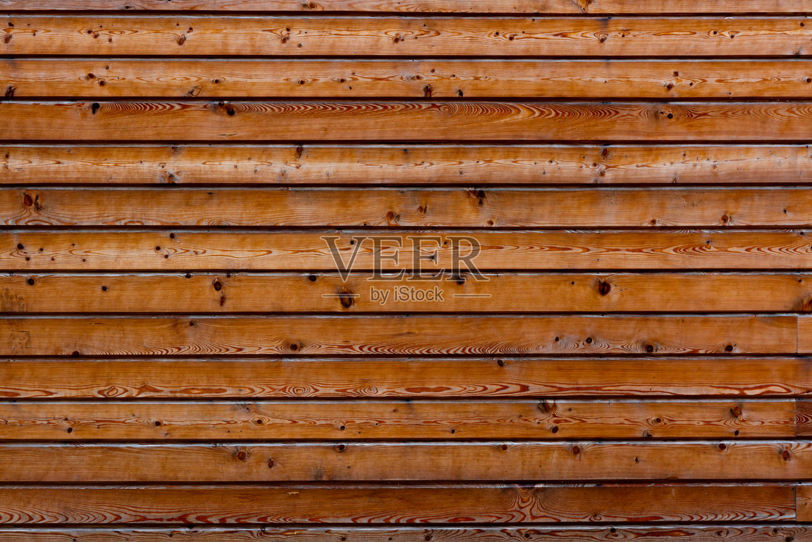 墙由水平排列的木板和松木组成照片摄影图片
