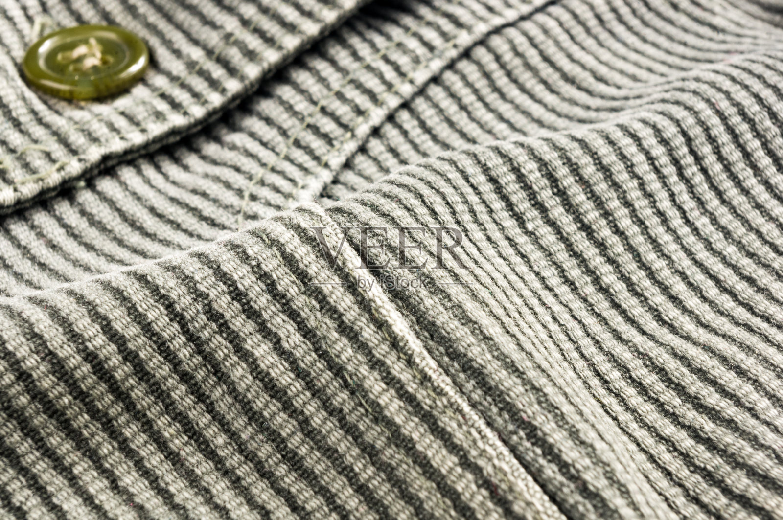 衣服项目石洗棉织物纹理接缝，扣，钮扣和铆钉，宏观照片摄影图片