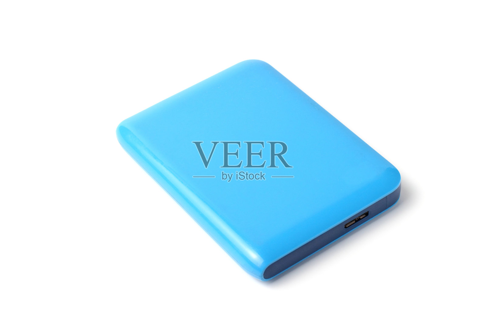 固态硬盘或硬盘外接驱动器，有大量内存，白色背景，特写。照片摄影图片