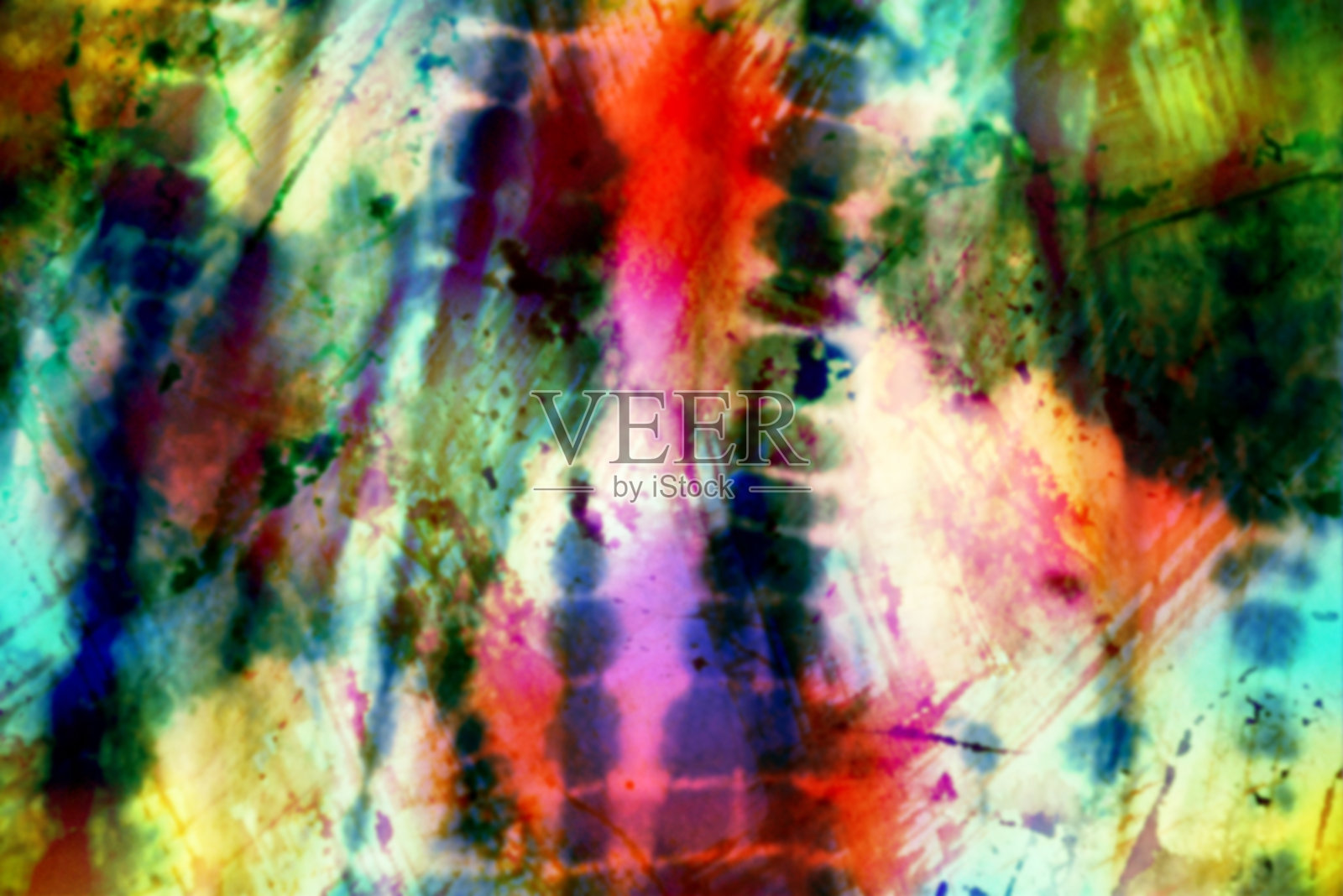 抽象图案的彩色扎染风格的纺织品为背景照片摄影图片