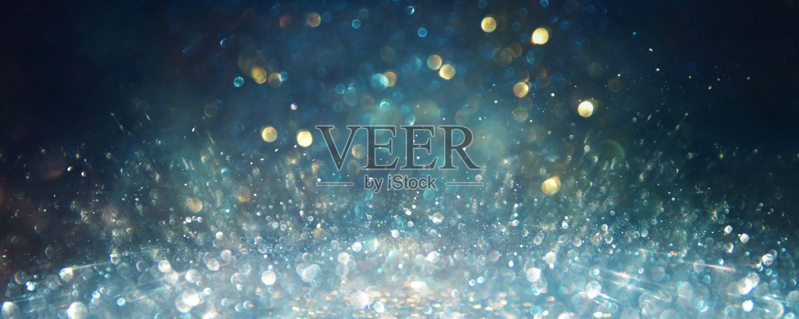 抽象闪烁的灯光背景。银色，蓝色和黑色。de集中照片摄影图片