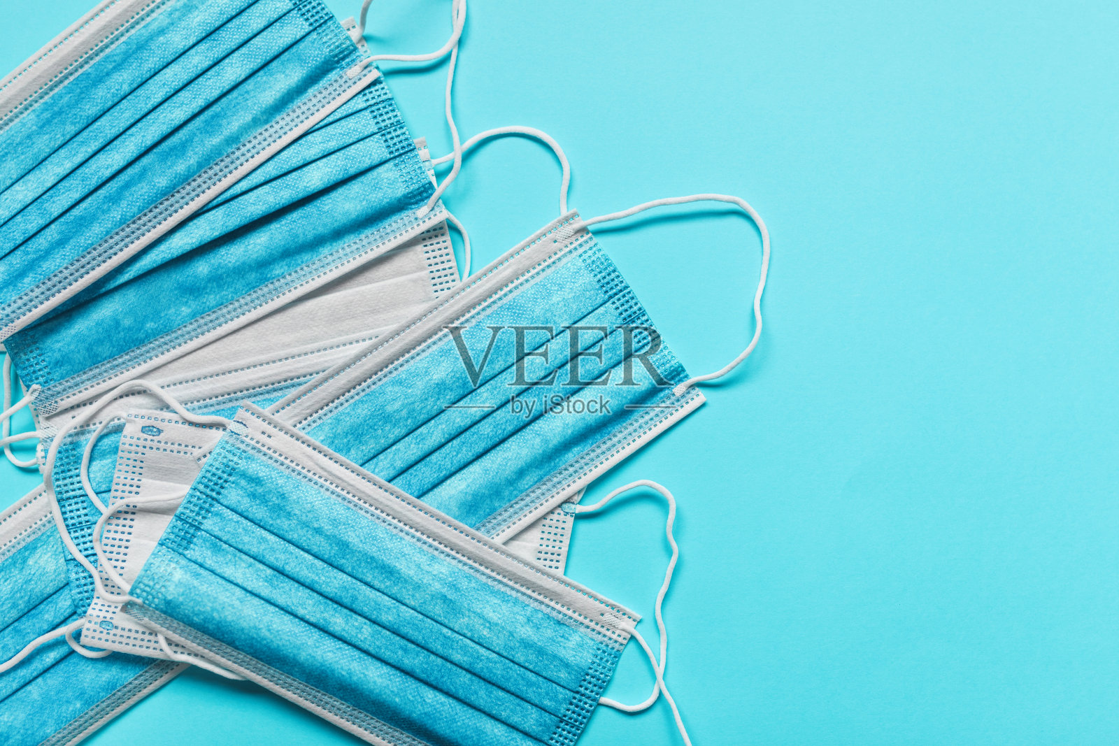医用防护口罩，蓝色背景照片摄影图片
