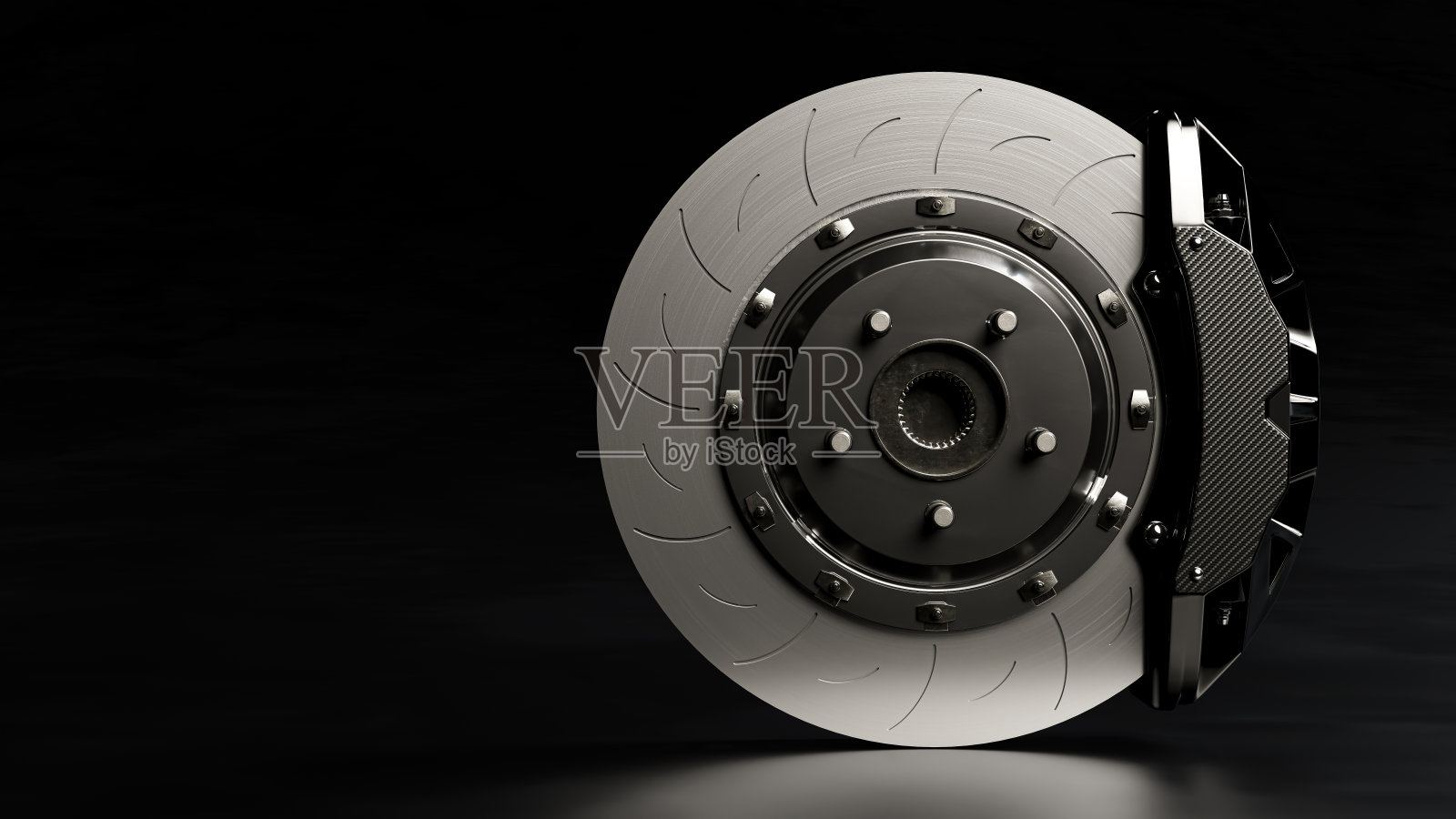 制动盘和黑色卡钳。照片摄影图片