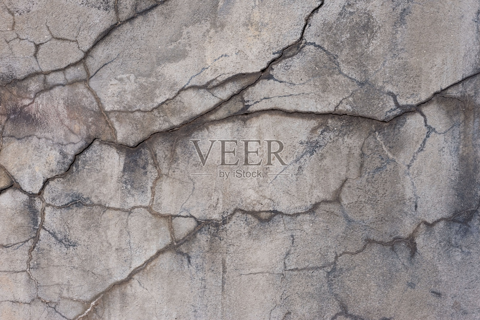 街道装饰石膏纹理有裂缝，色调温暖照片摄影图片