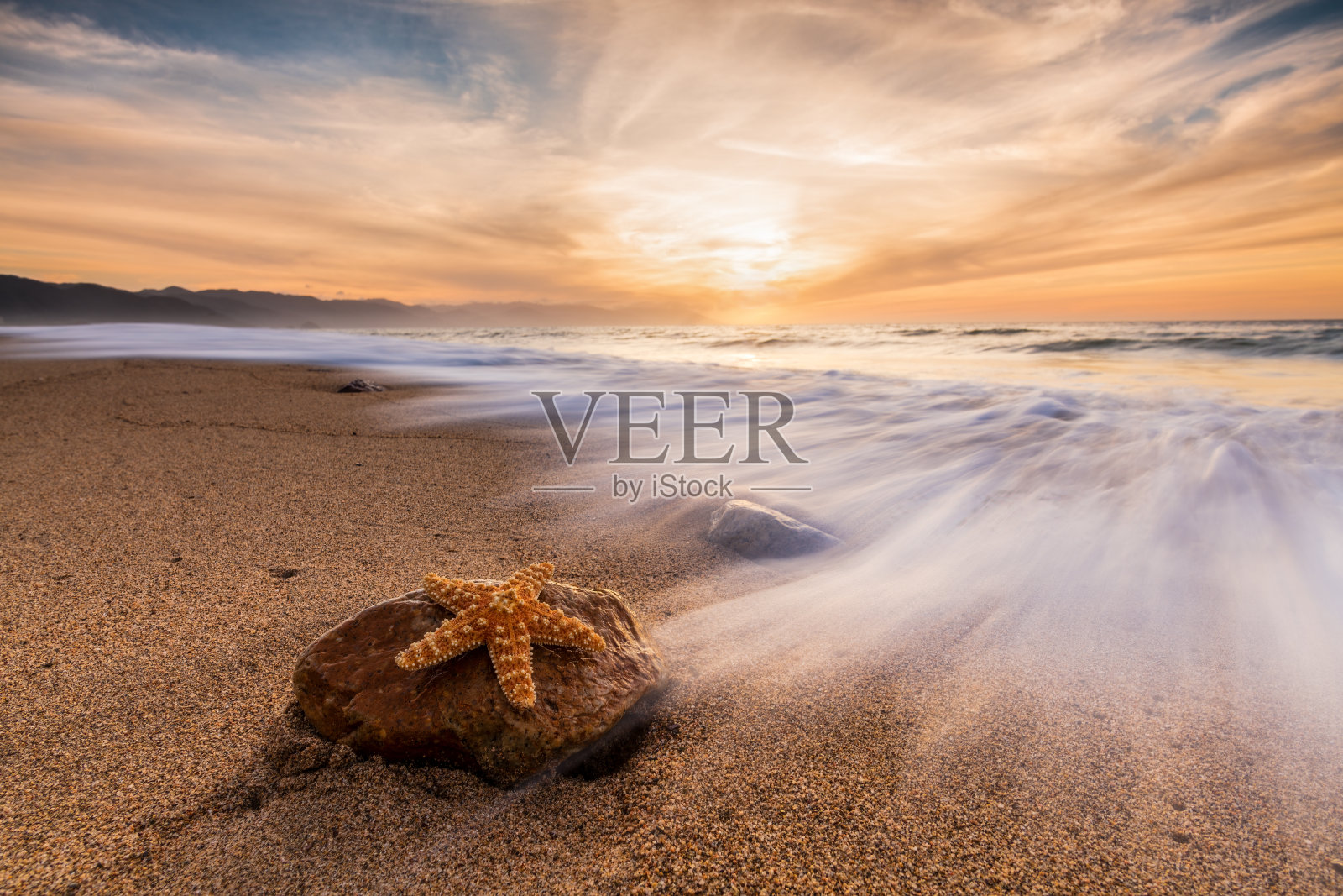 日落海洋海星照片摄影图片