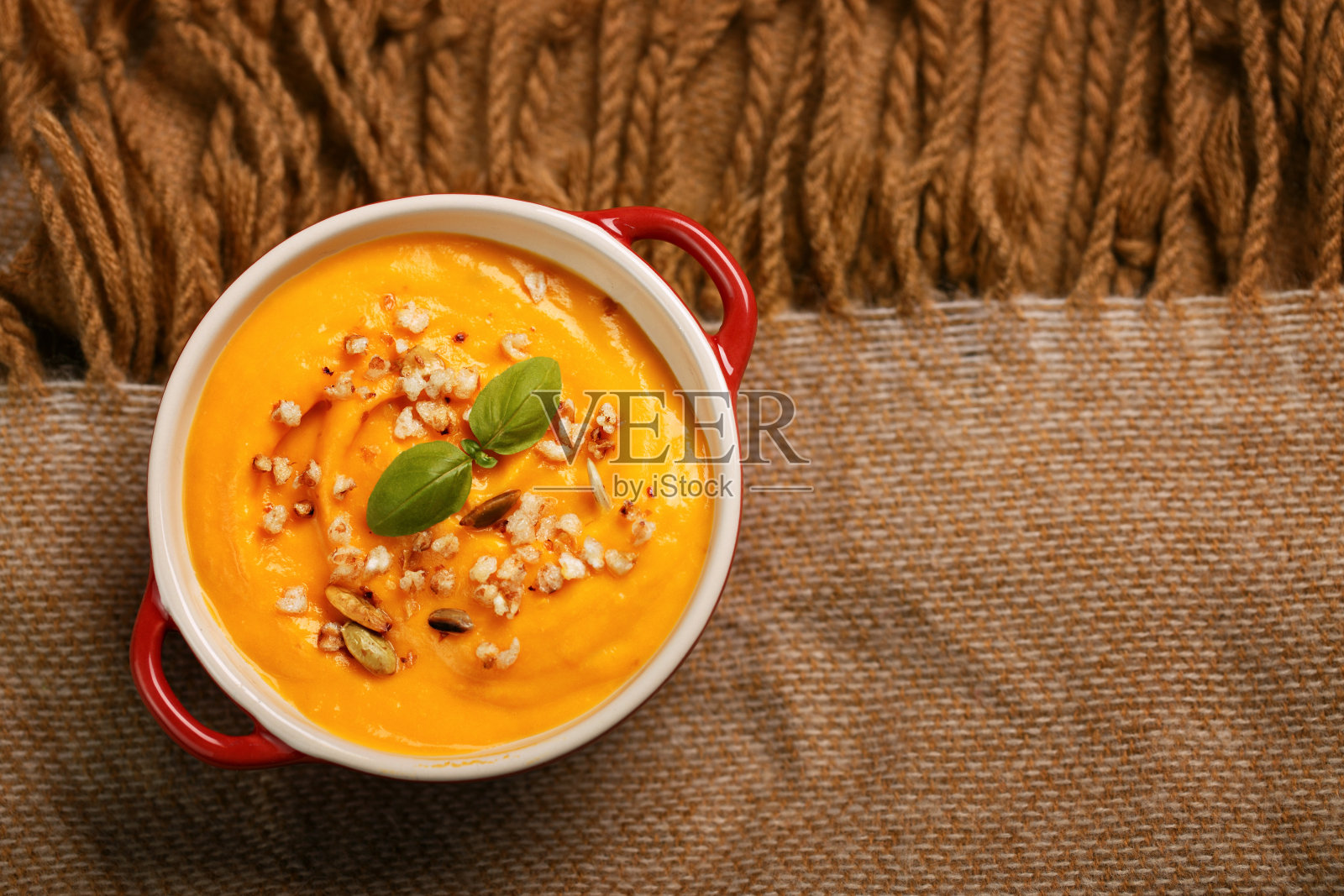 南瓜汤与种子编织的背景照片摄影图片