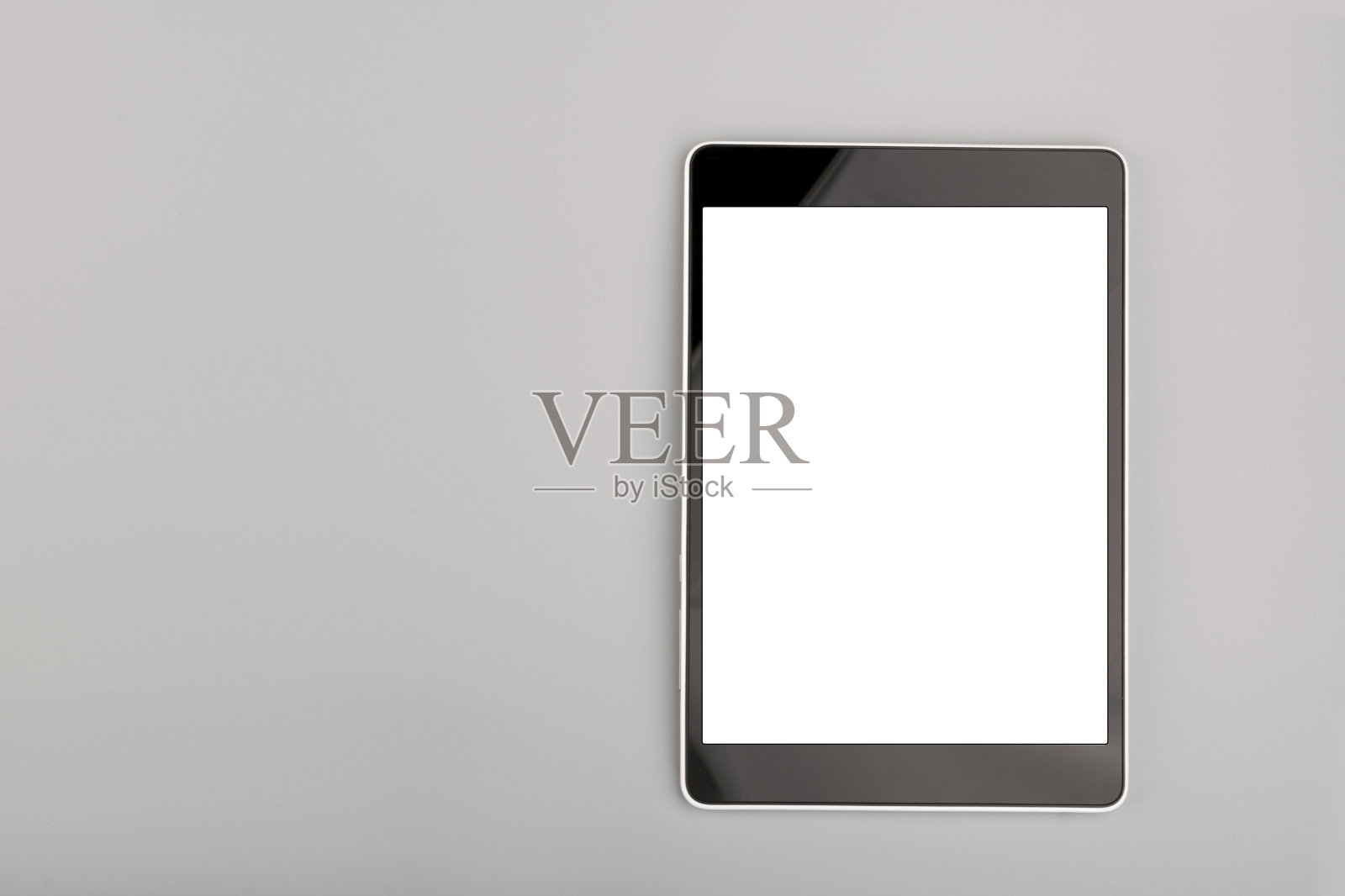 灰色背景上的空白平板电脑照片摄影图片