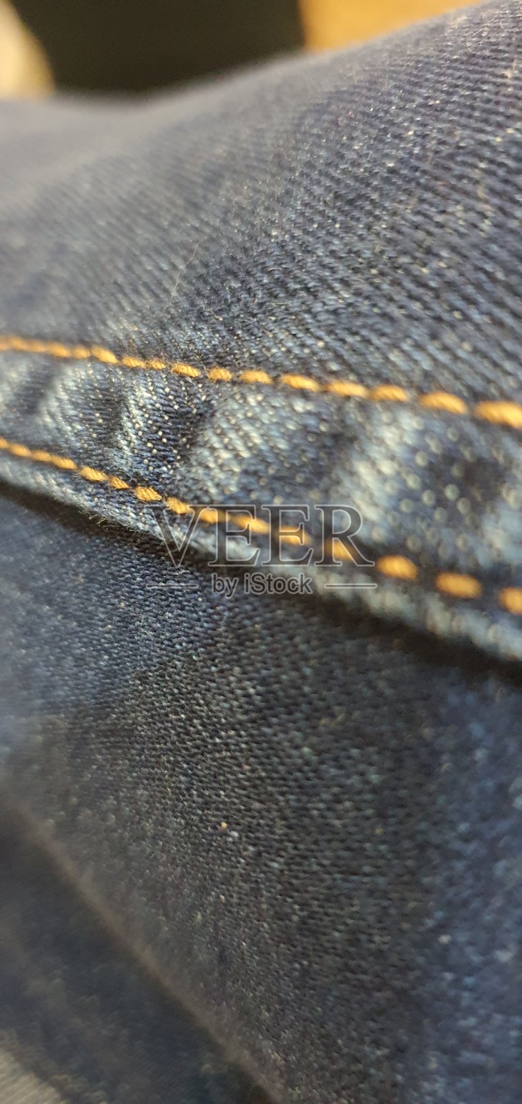 牛仔牛仔裤上的针脚照片摄影图片