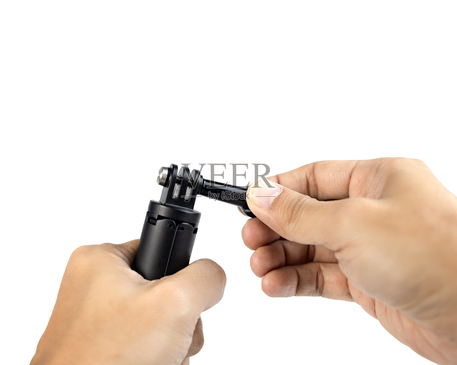 两只手握迷你三脚架与空白的空间。孤立在白色背景上。剪辑路径。照片摄影图片