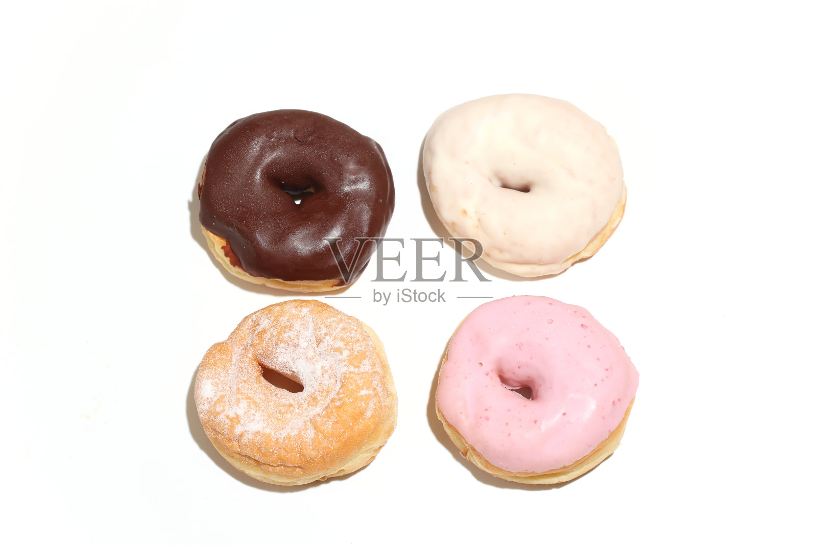 白色背景下的甜甜圈照片摄影图片