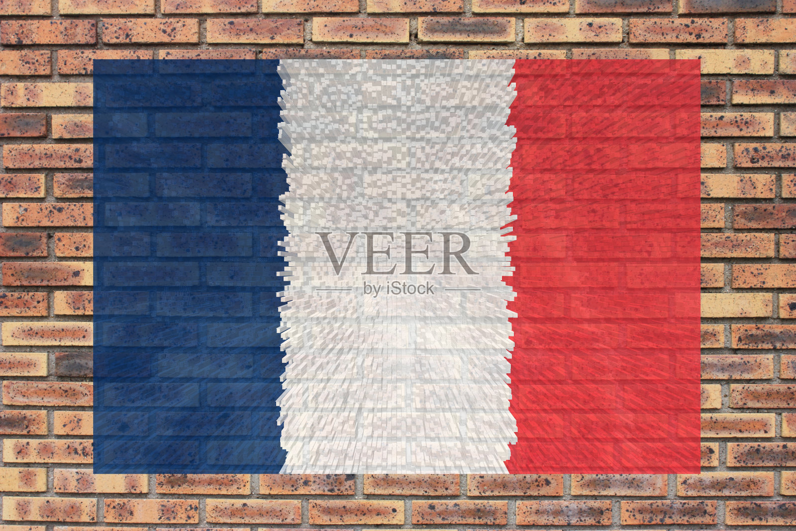 7月14日，一面挂在砖墙上的法国国旗照片摄影图片