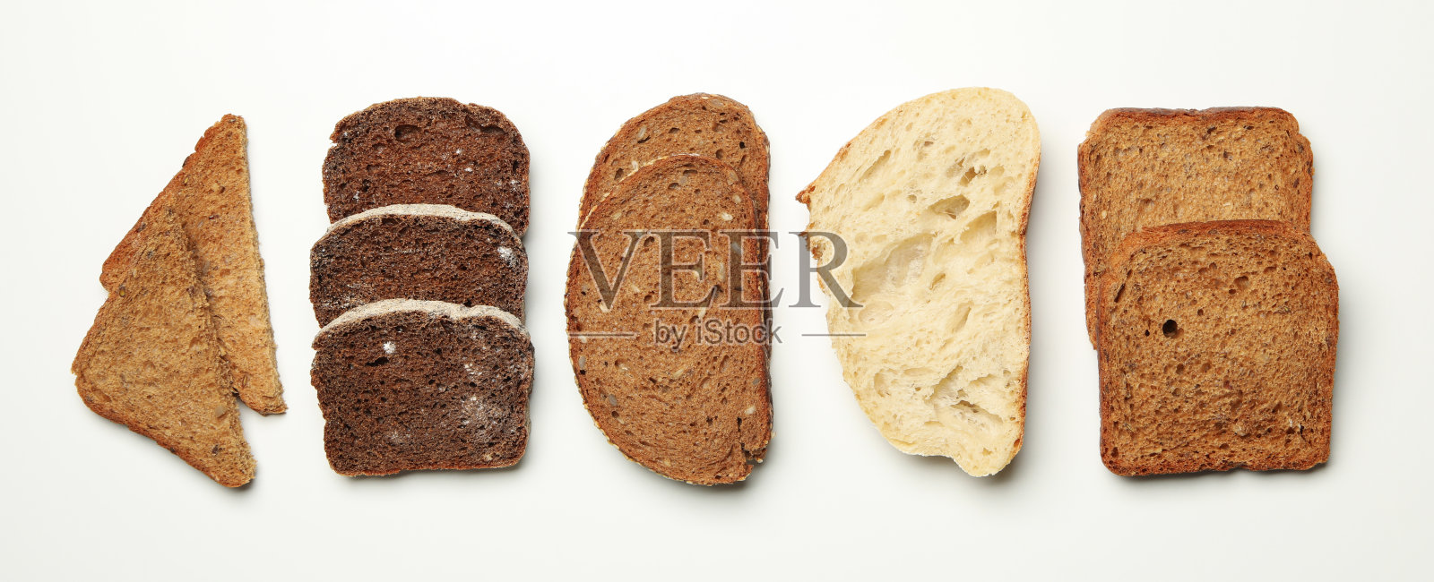 不同的面包片在白色背景，文字空间照片摄影图片