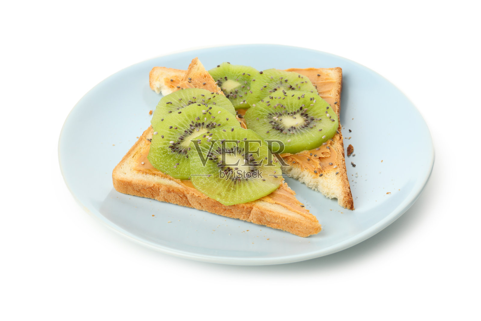 盘子上的烤面包与猕猴桃孤立在白色的背景照片摄影图片