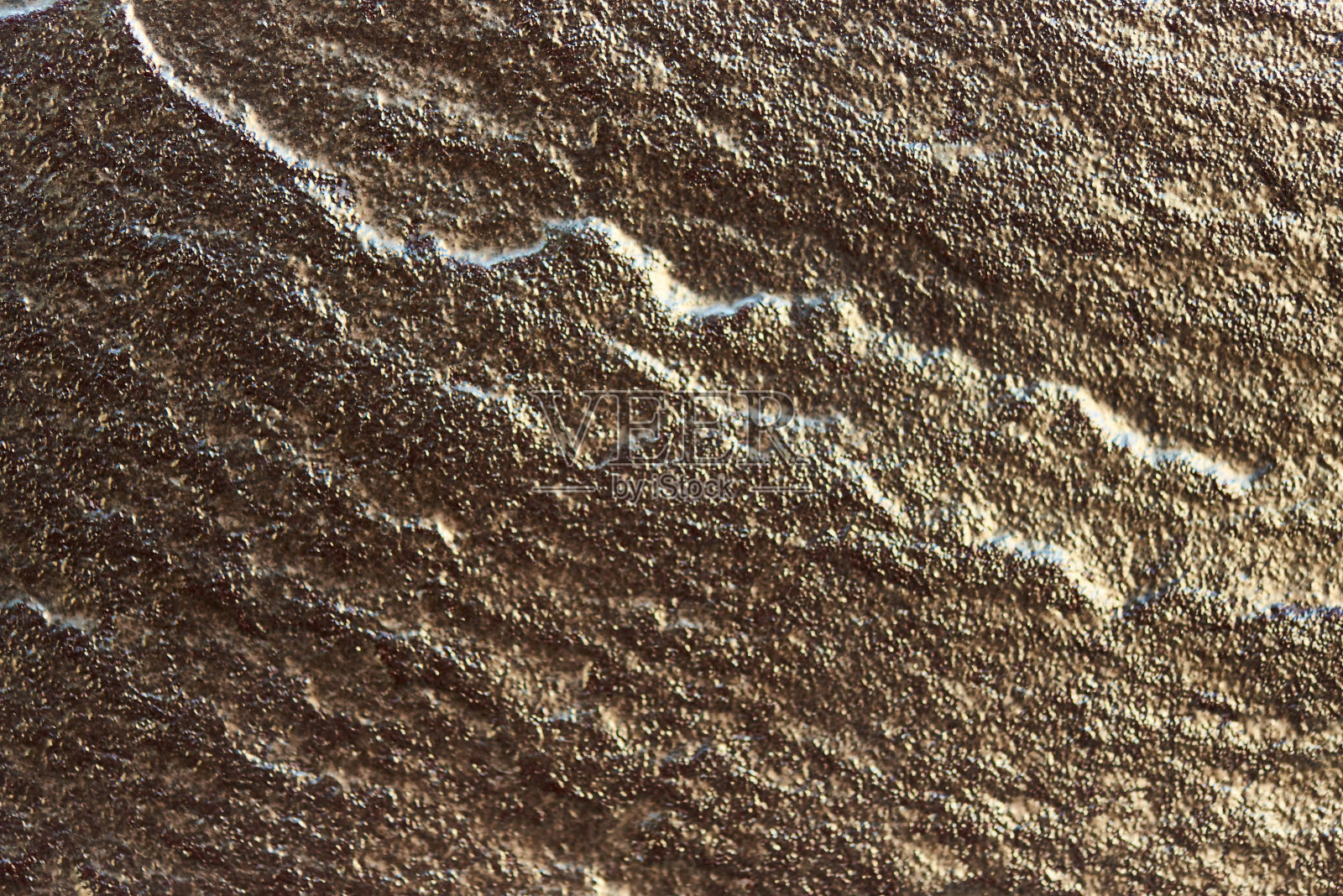 金色的石头纹理作为背景。照片摄影图片