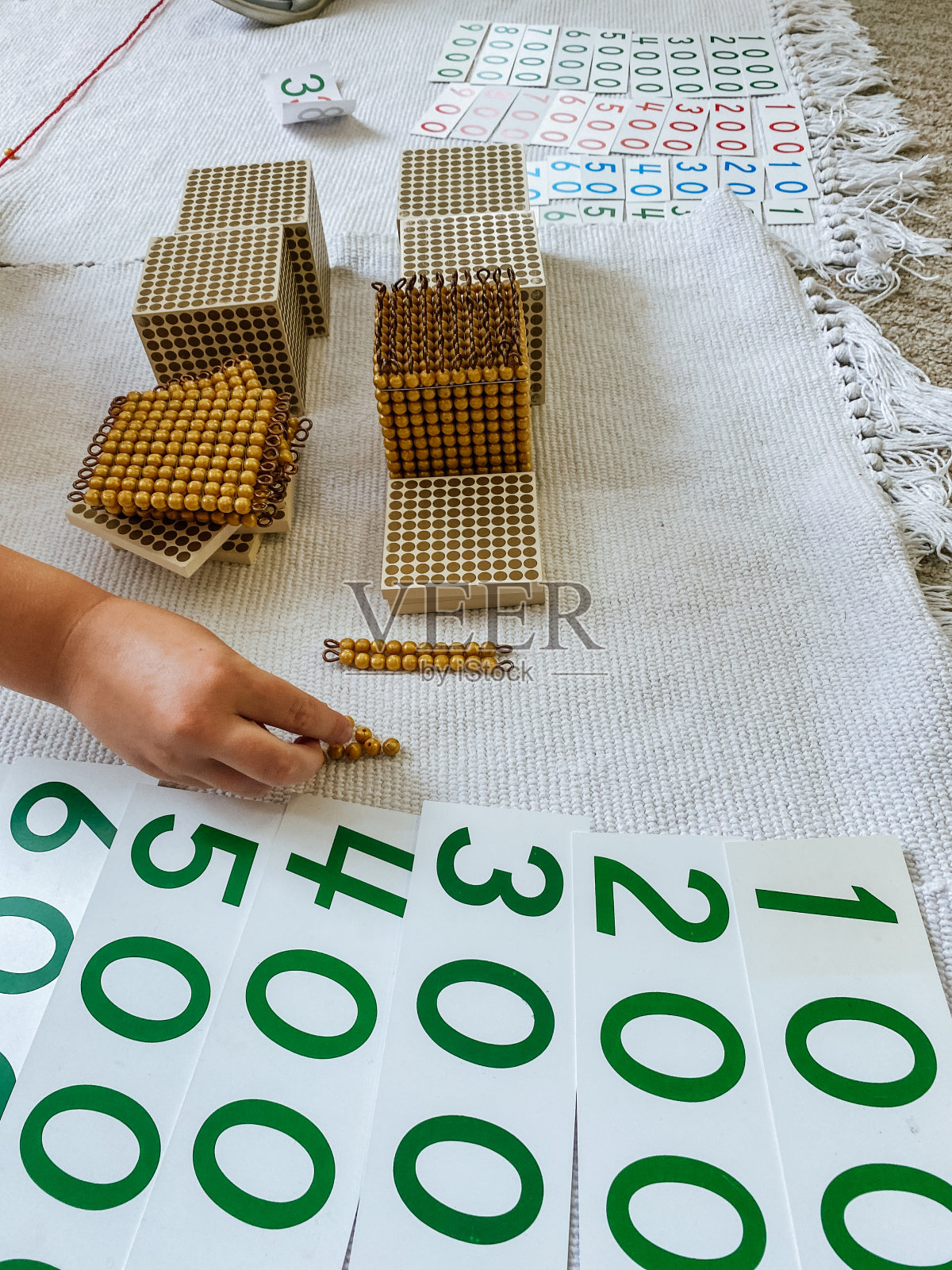 蒙台梭利金材料数学数十进位制数单元十〇一万一照片摄影图片