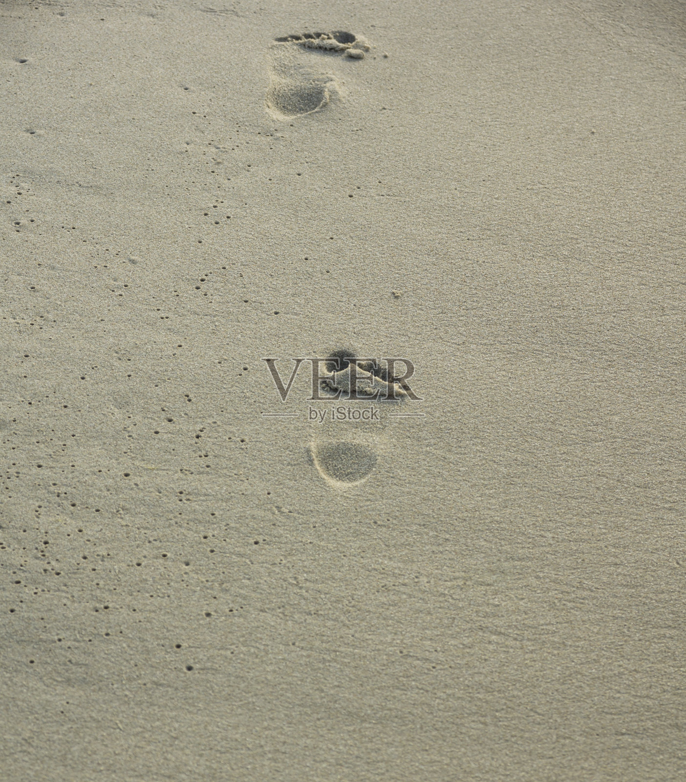 沙滩上的脚印照片摄影图片
