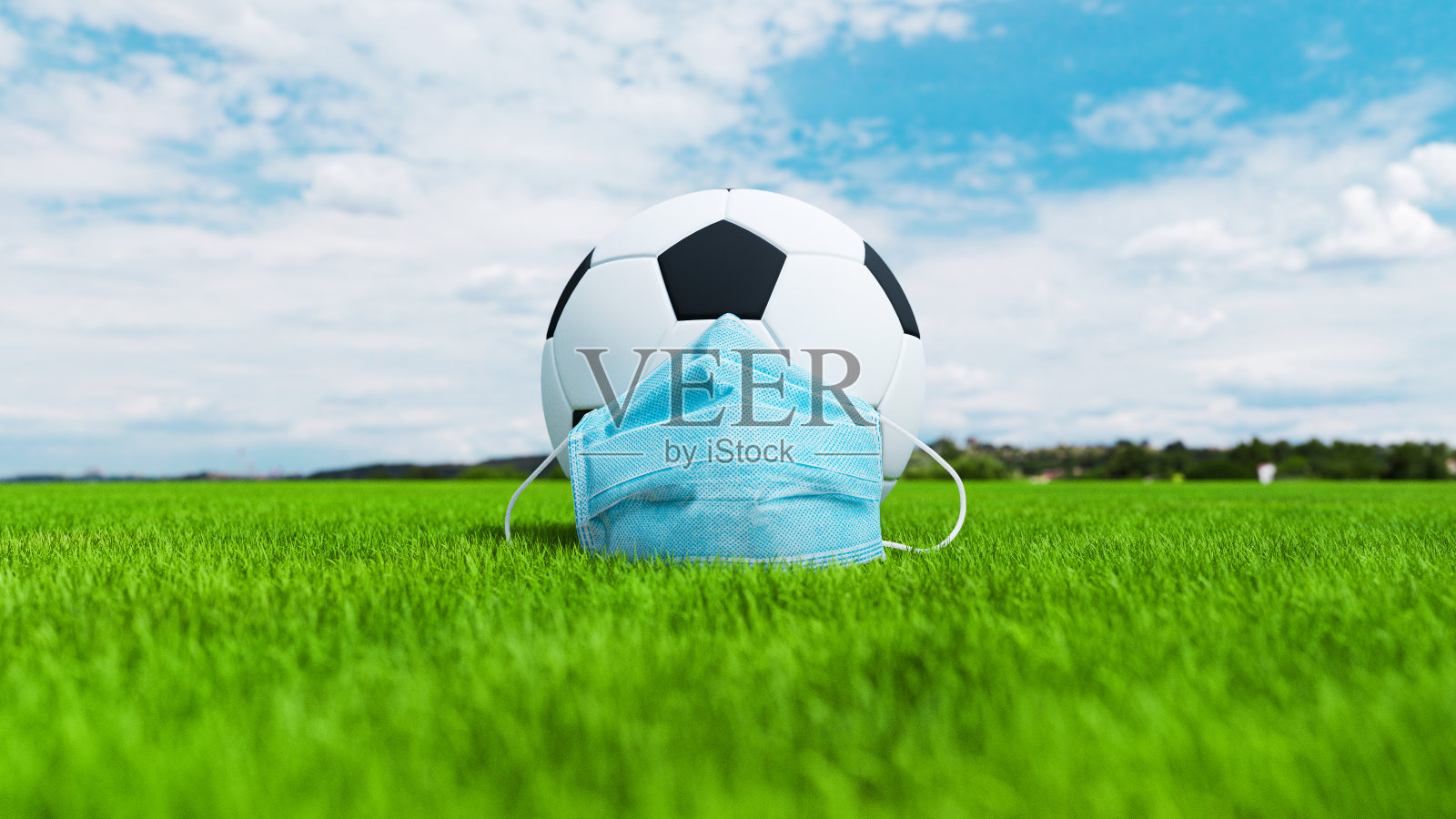 足球带口罩，防止疾病照片摄影图片