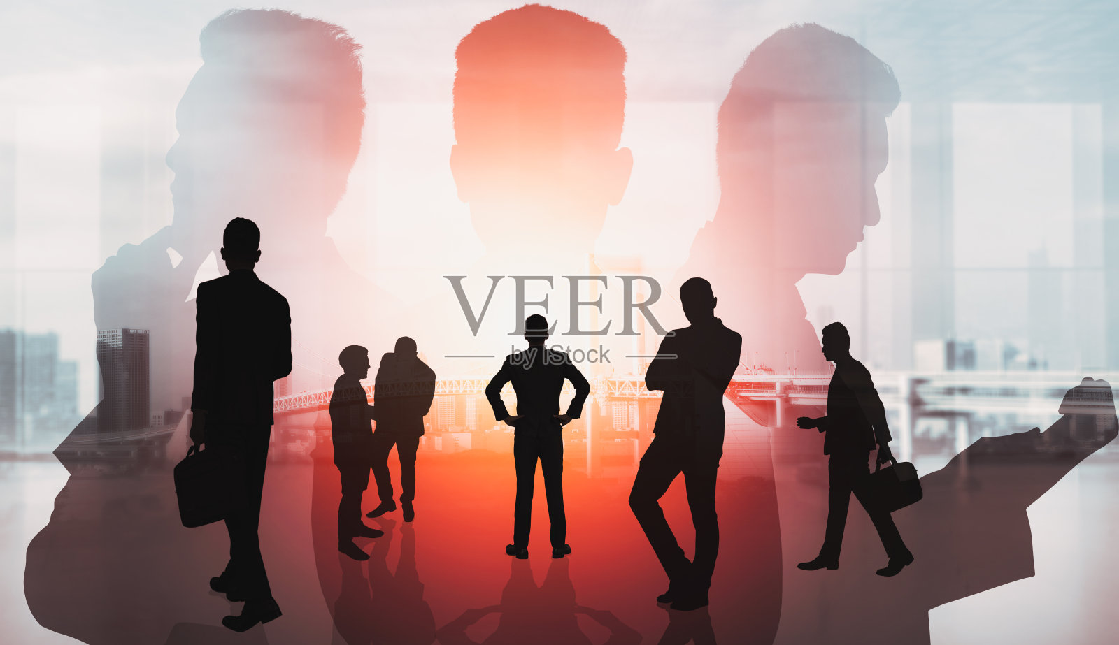 以城市为背景，塑造了众多商业人士聚在一起的抽象形象照片摄影图片