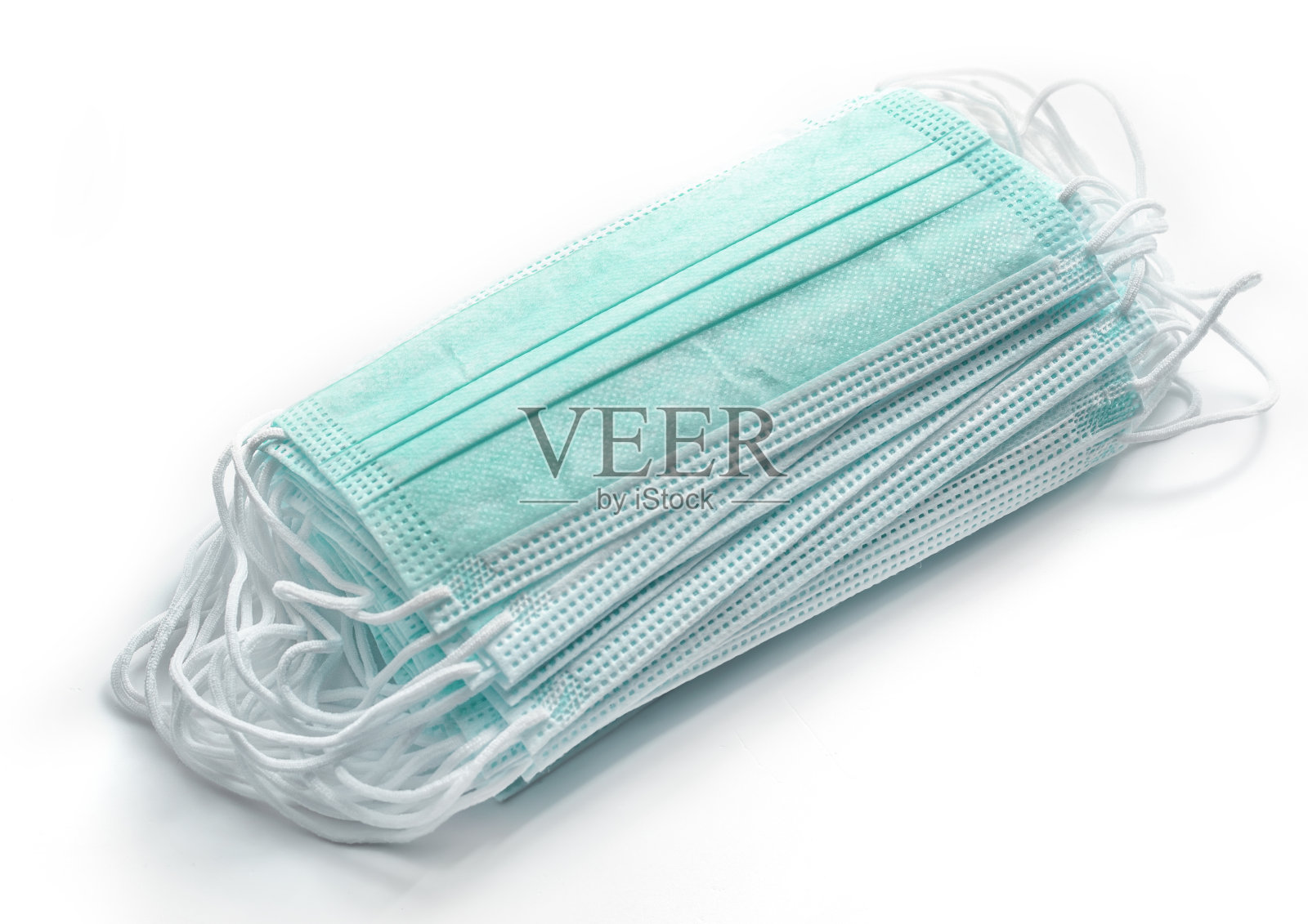 防护新型冠状病毒肺炎的白色绳带绿色医用口罩照片摄影图片