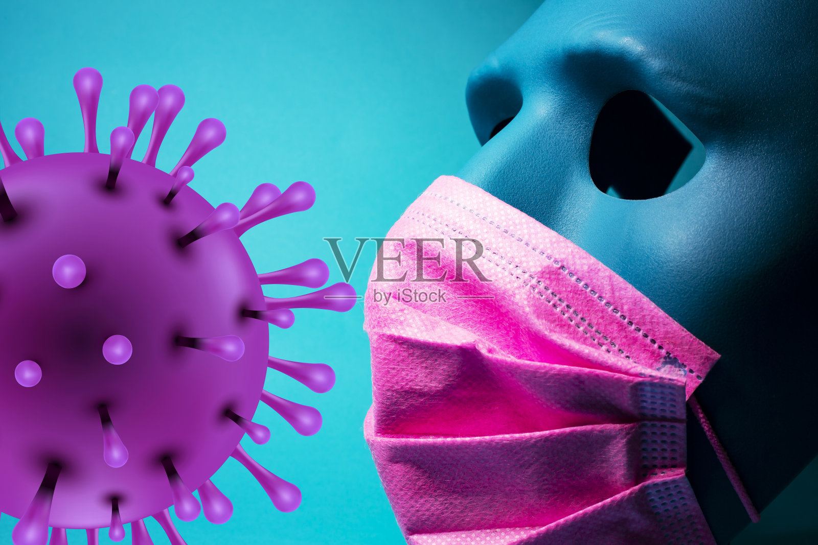 粉色医用口罩和蓝色口罩，黑色背景照片摄影图片