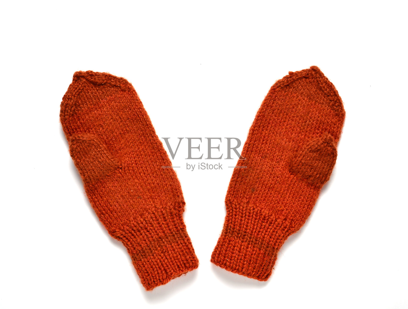 手工制作的冬季婴儿手套。白色背景。冬季概念，圣诞新年，照片摄影图片