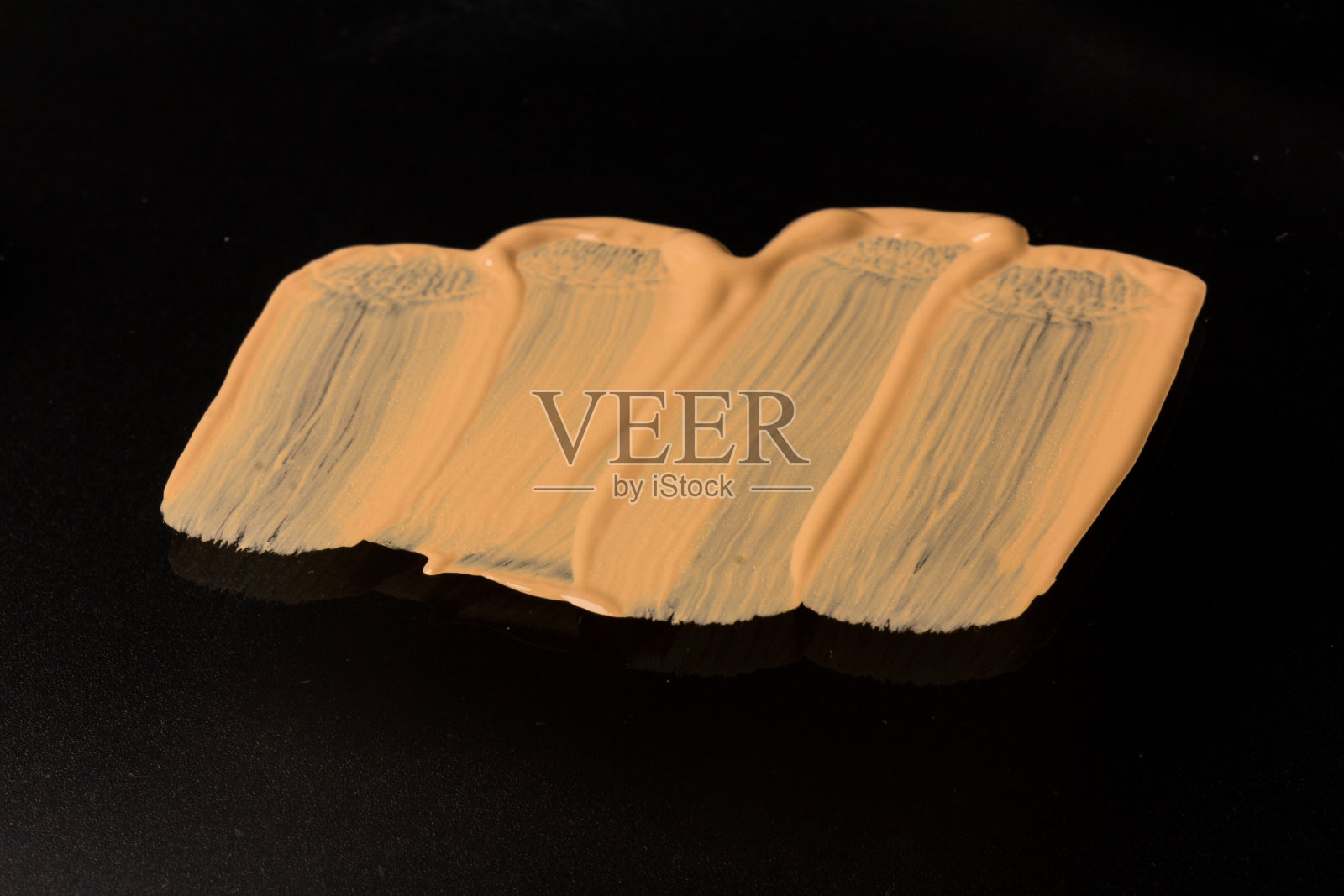 质感液体粉底背景采用液体粉底的化妆理念。肤色奶油照片摄影图片