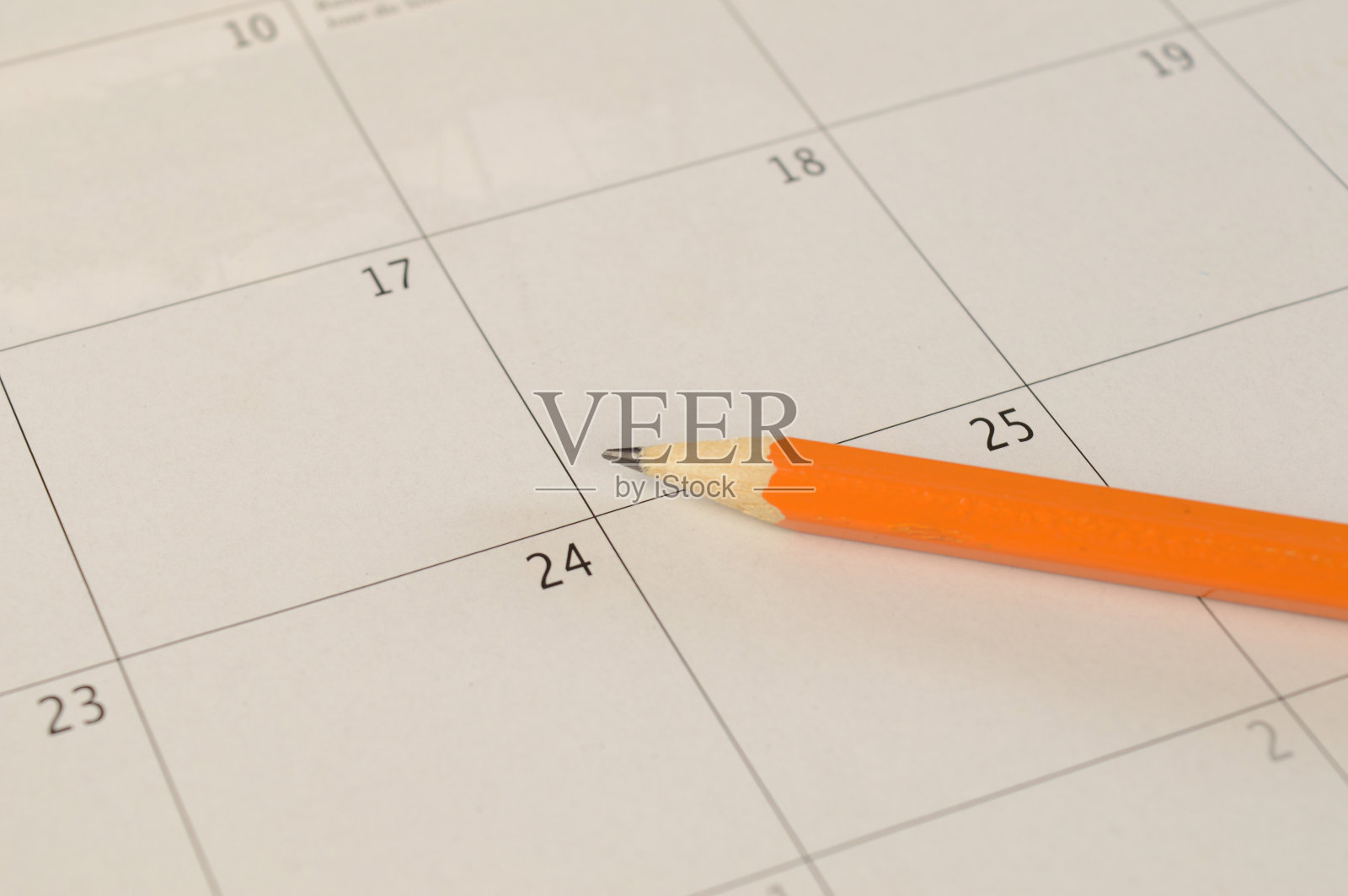 用铅笔写在日历上照片摄影图片