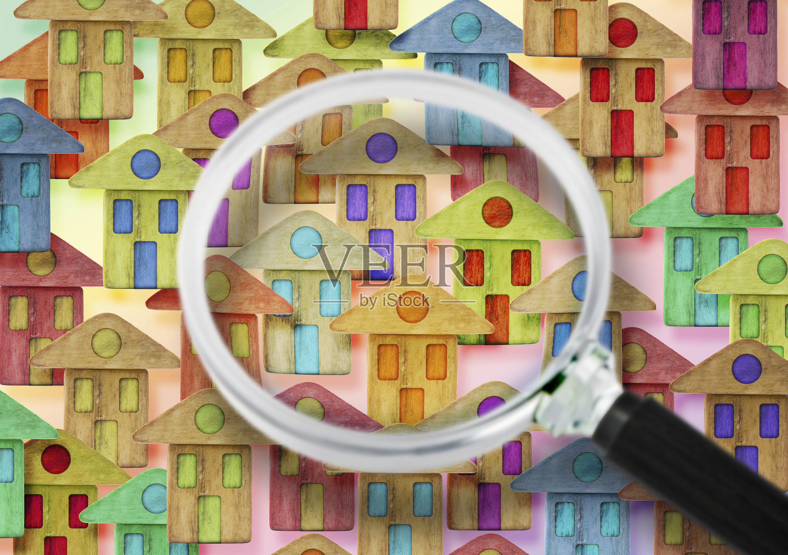 寻找新的家庭概念图像与彩色的房子透过放大镜看到照片摄影图片