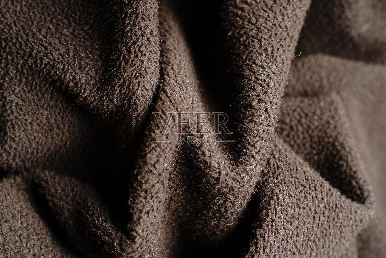 纺织黑色纹理，进入波浪。照片摄影图片