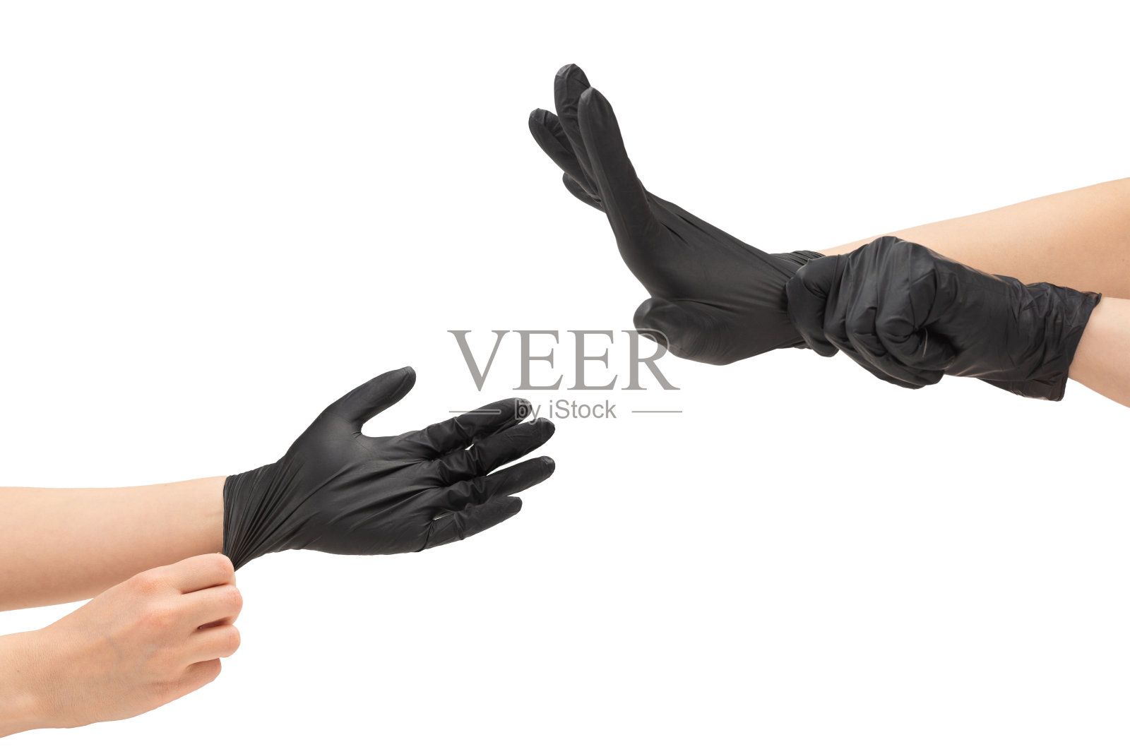 女人戴上了黑色橡胶手套。照片摄影图片