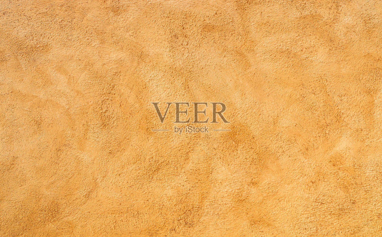 墙壁纹理-橙色/黄色的细微差别。照片摄影图片