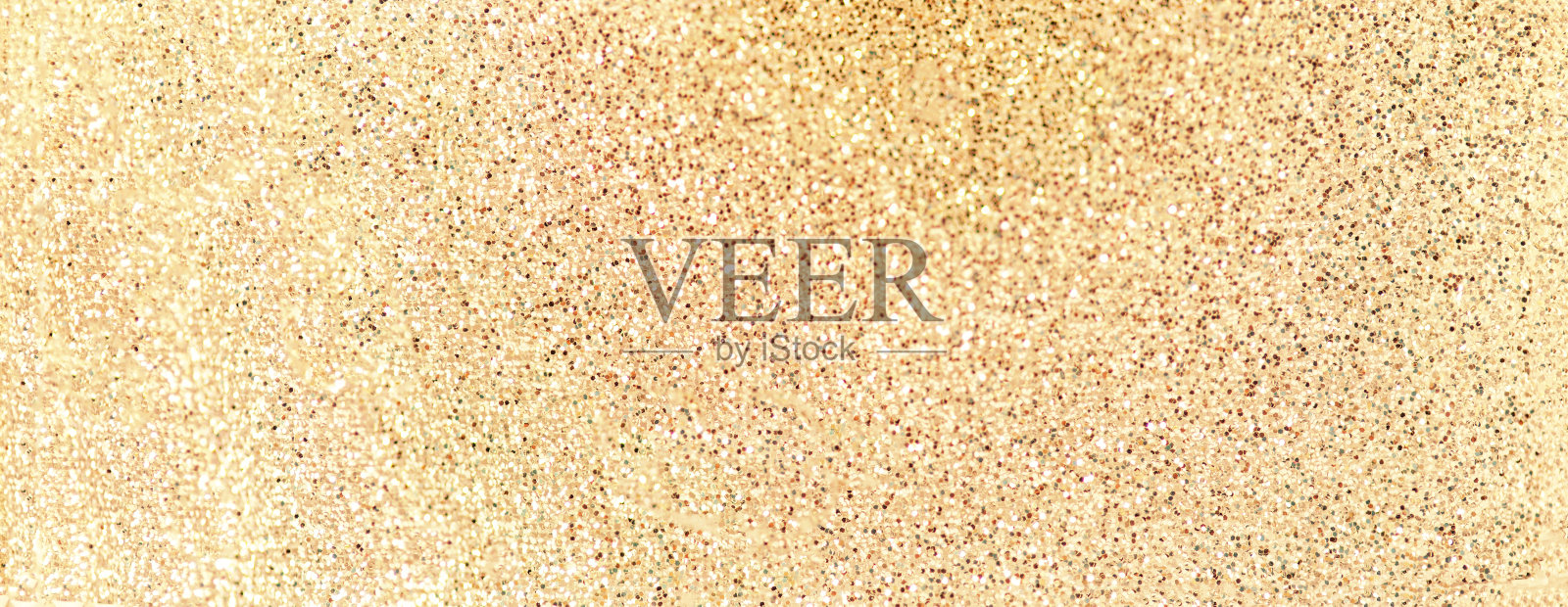 金色纹理与闪闪发光的灯光。黄色抽象圣诞背景。散景假日卡照片摄影图片