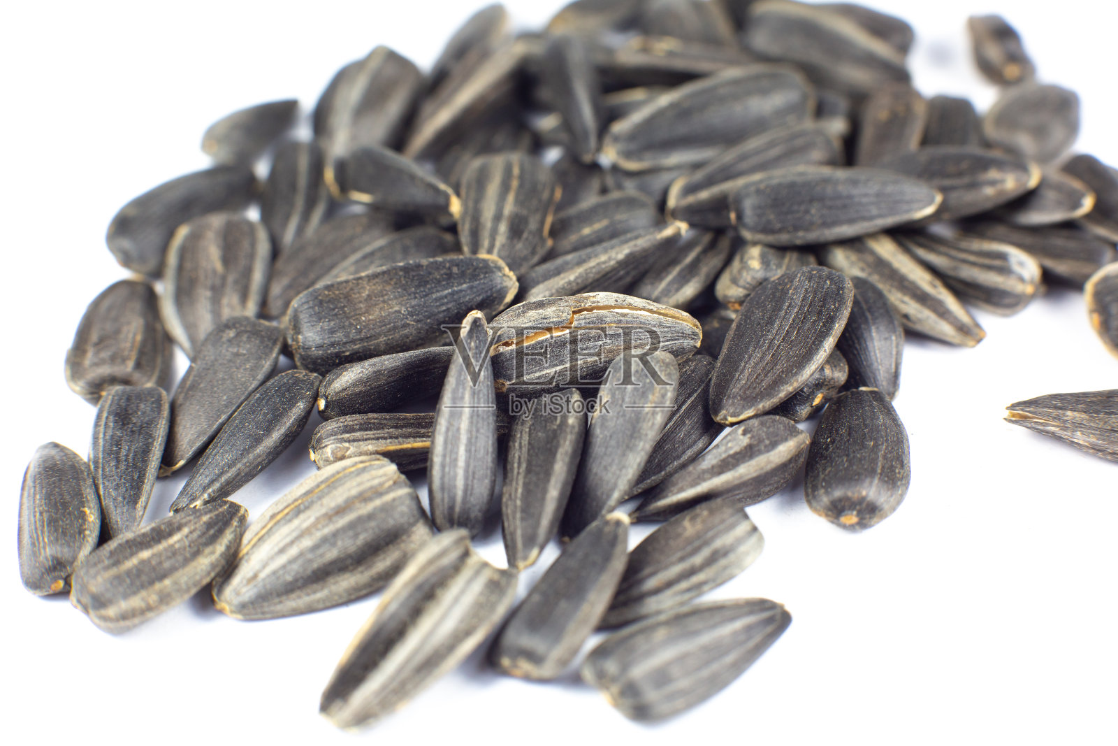 炸黑葵花籽，近了。照片摄影图片