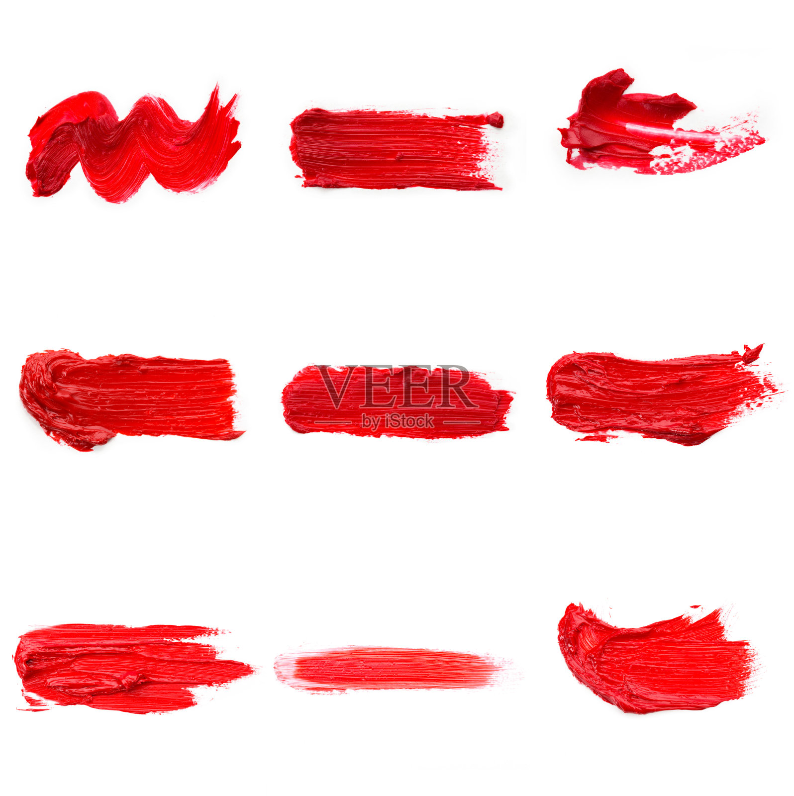 口红污迹样本孤立的白色背景。膏妆质感。鲜红的彩妆品刷一刷样品照片摄影图片