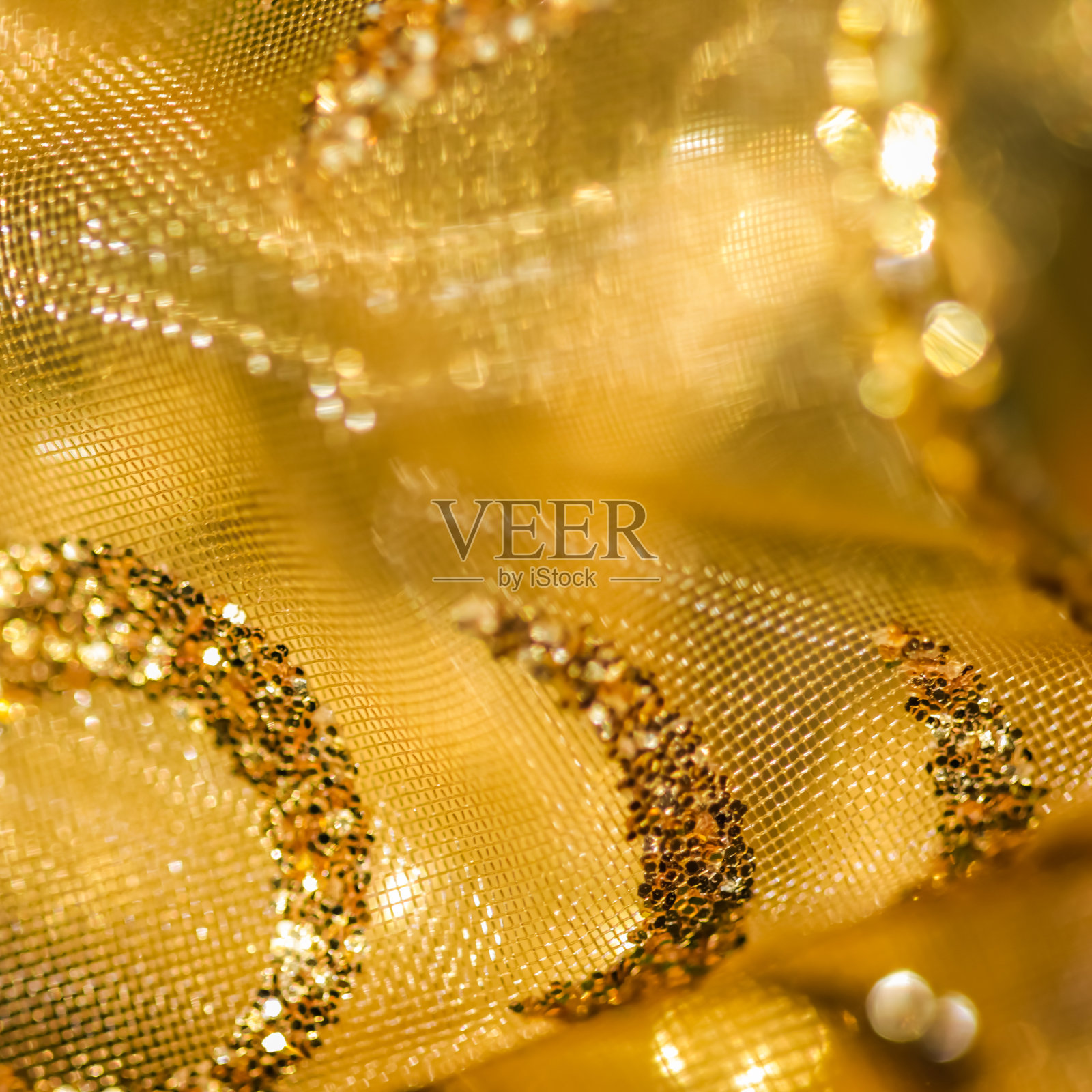 金色抽象模糊散焦背景。概念新年前夕，圣诞节和快乐的假期照片摄影图片