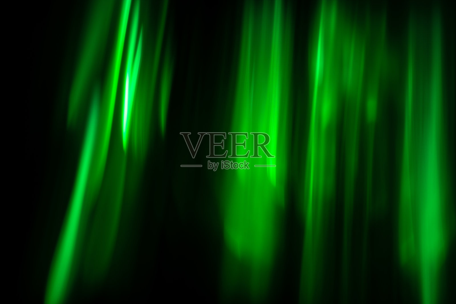 离焦抽象绿色背景的速度相机移动在发光的灯照片摄影图片