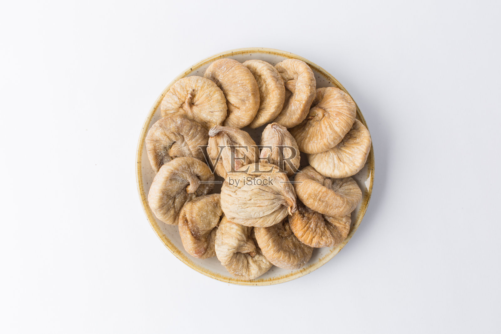 干燥的无花果盘，白色背景照片摄影图片