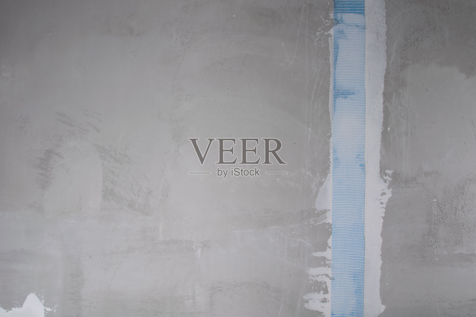 混凝土墙，用钢筋胶带加强抹灰裂缝，留有题字空间照片摄影图片