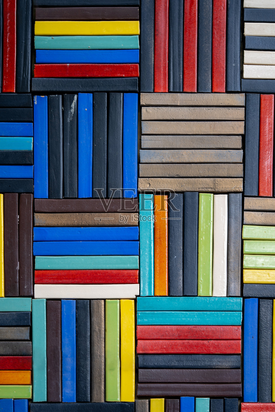 水泥艺术图案色彩斑斓的背景像摆放在墙上的书籍。照片摄影图片