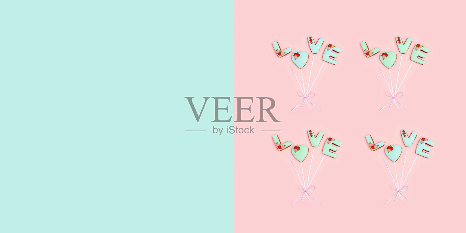 用自制的饼干做成的带有“爱的话语”的贺卡，就像用丝带连接的气球。情人节食物概念。照片摄影图片