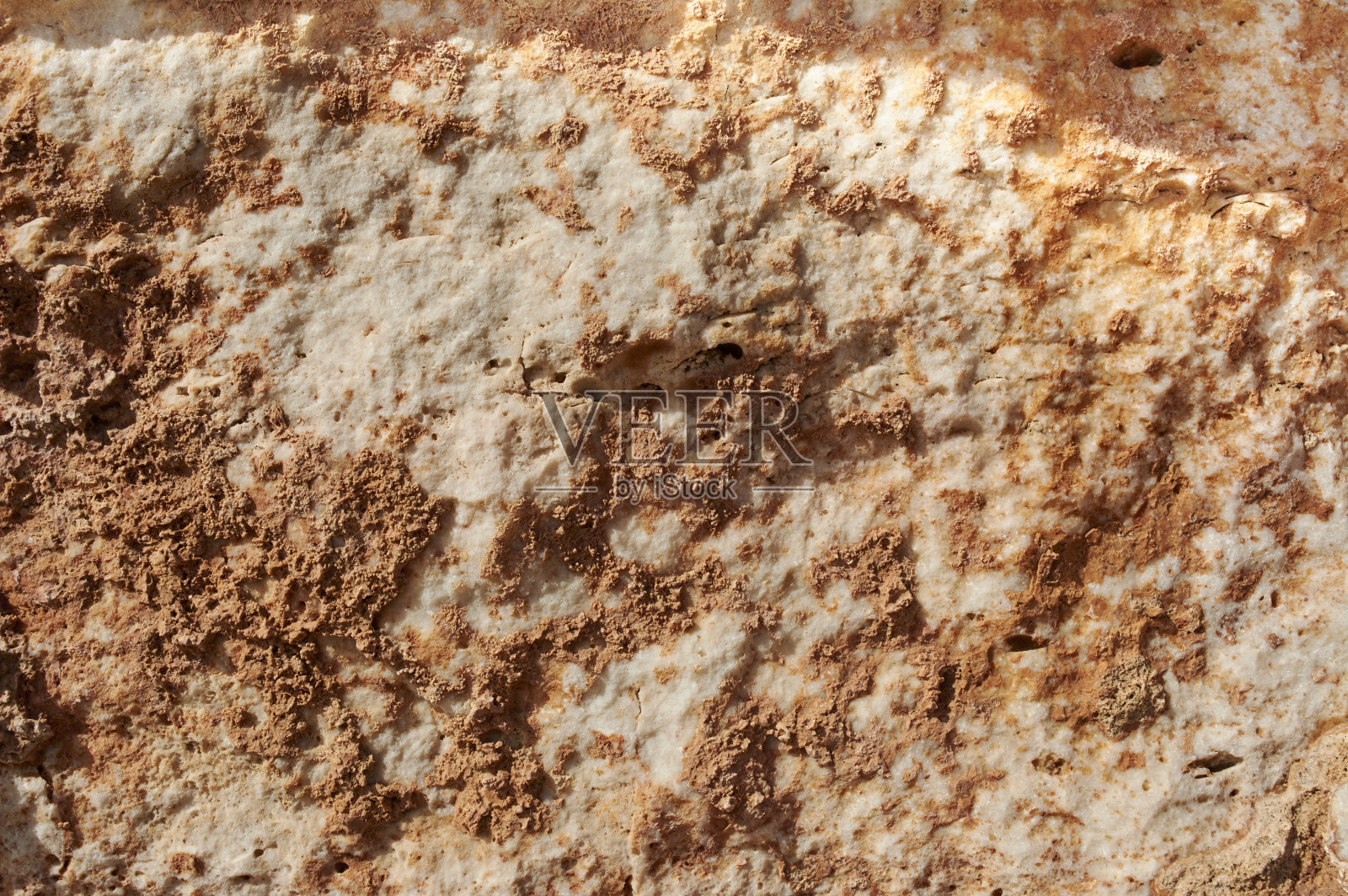 有纹理的石头、砂岩、石灰石表面。关闭图像。石材，自然抽象纹理为背景。关闭了。壁纸、架构。照片摄影图片