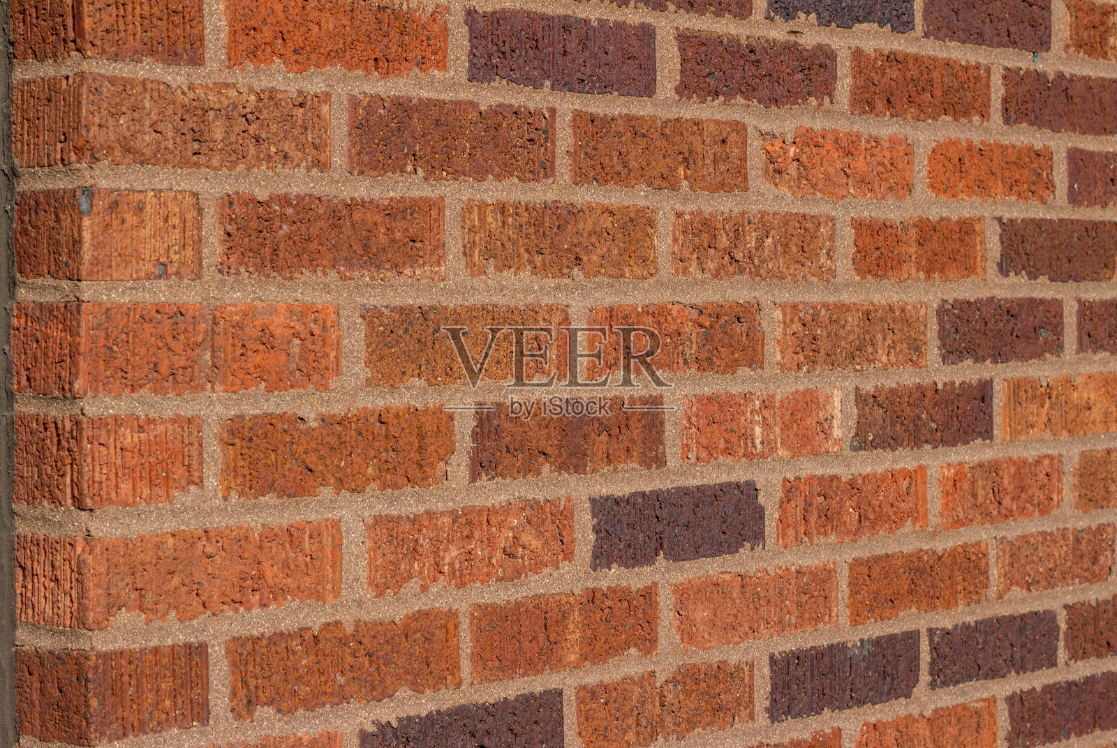 传统砖墙与温暖的多色调的棕色和棕褐色照片摄影图片