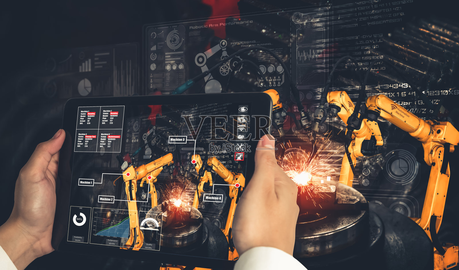 工程师通过增强现实工业技术控制机械臂照片摄影图片