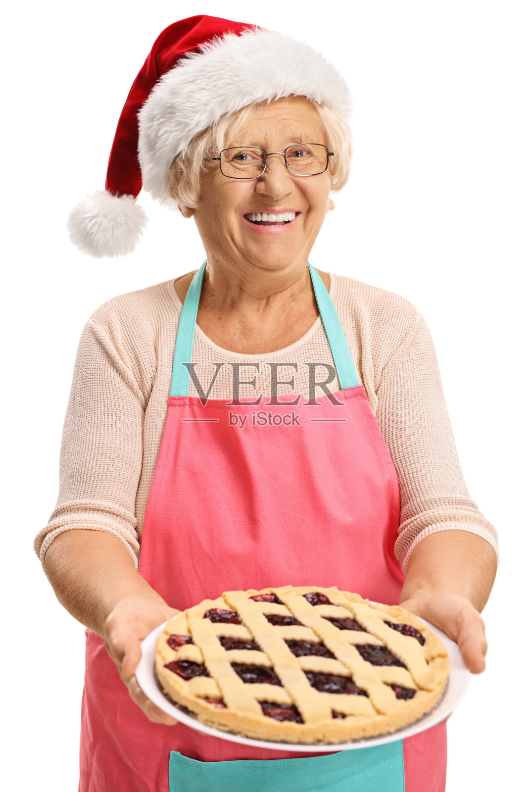 老妇人拿着圣诞派照片摄影图片