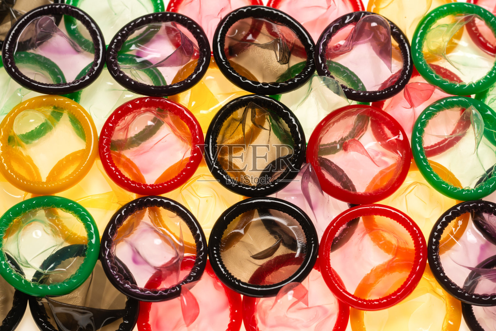 彩色避孕套背景。照片摄影图片