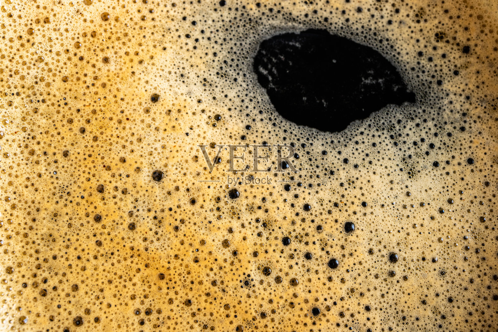 咖啡图案。咖啡口感。咖啡和泡沫特写照片摄影图片