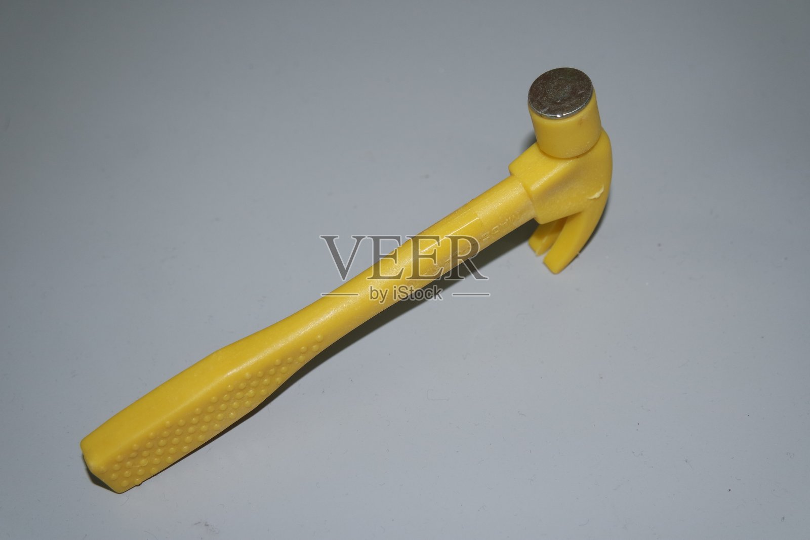 选择性聚焦，特写玩具锤制成的塑料照片摄影图片